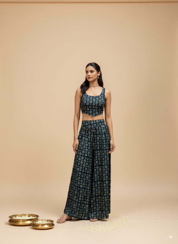 Woman wearing a black patterned outfit on a beige background