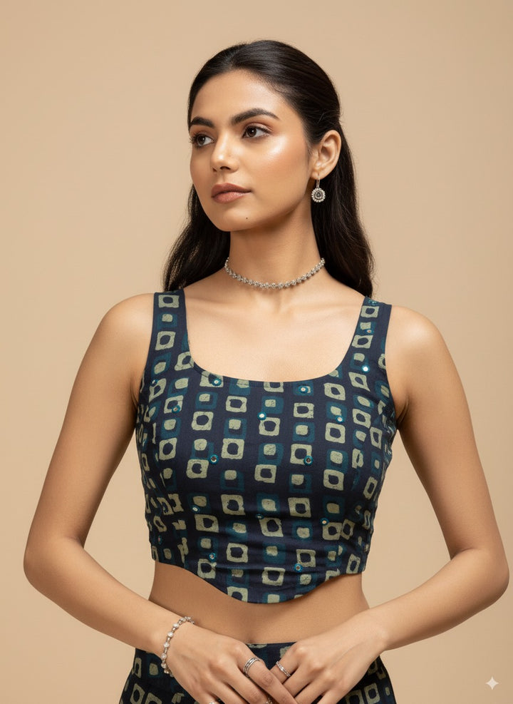 Woman wearing a blue patterned top against a beige background